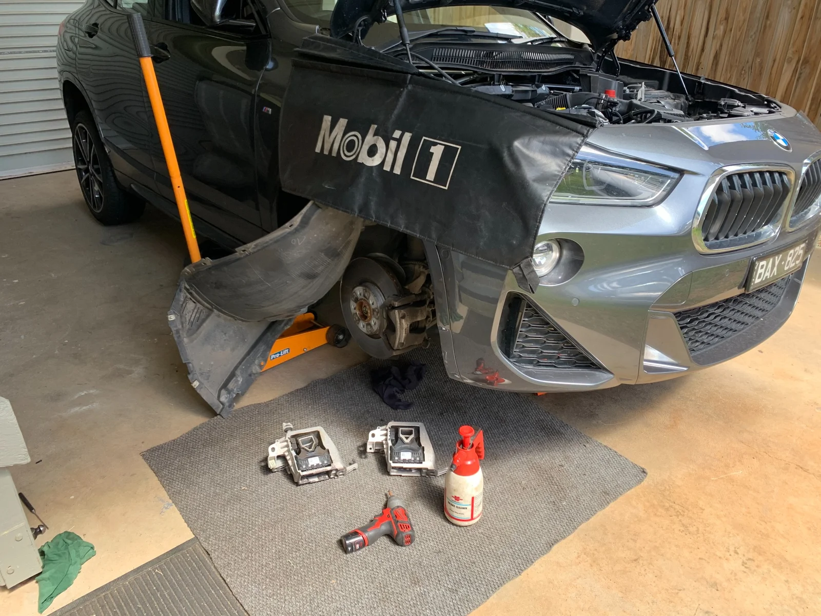 BMW X2 brake and suspension work with wheel removed in workshop for service